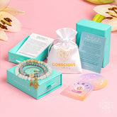 Golden Hand of Fortune jewelry set with bracelets of wealth in sleek packaging, featuring intricate gold designs from Conscious Items.