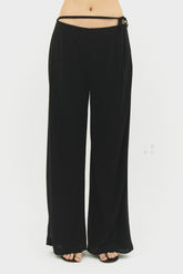 Black Emilia pants by findmenowthelabel, shown flat with front view, featuring tailored fit and sleek fabric.