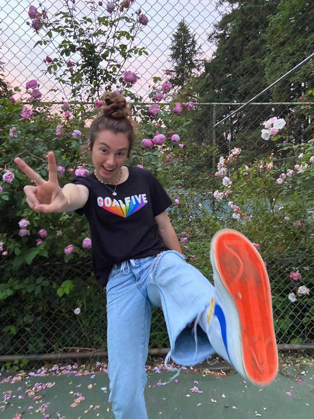Black cotton Superhuman T-shirt by Goal Five, featuring a stylish lifestyle design, worn by HaileyColl in a casual setting.