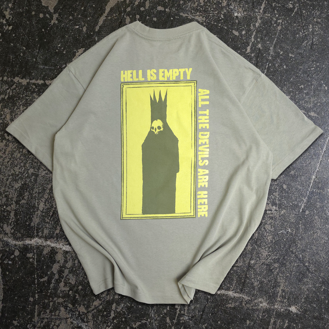Back view of Any Means Necessary Clothing Hell is Empty T-Shirt in sage green, featuring a graphic design on the back.