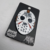 Close-up of a Hockey Hyena enamel pin from Any Means Necessary Clothing, featuring a detailed hyena design on a metal pin.
