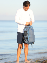 Simple white water life day trip backpack with adjustable straps and multiple compartments, ideal for outdoor adventures.