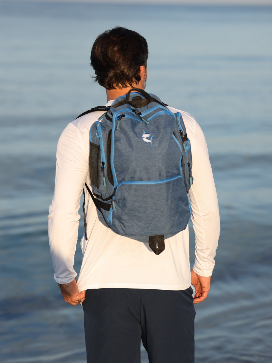Simple white water life day trip backpack with adjustable straps and multiple compartments, designed for outdoor adventures.