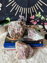 Raw pink tourmaline stone from Evermore Everlasting, showcasing its natural pink mineral formation and textured surface.