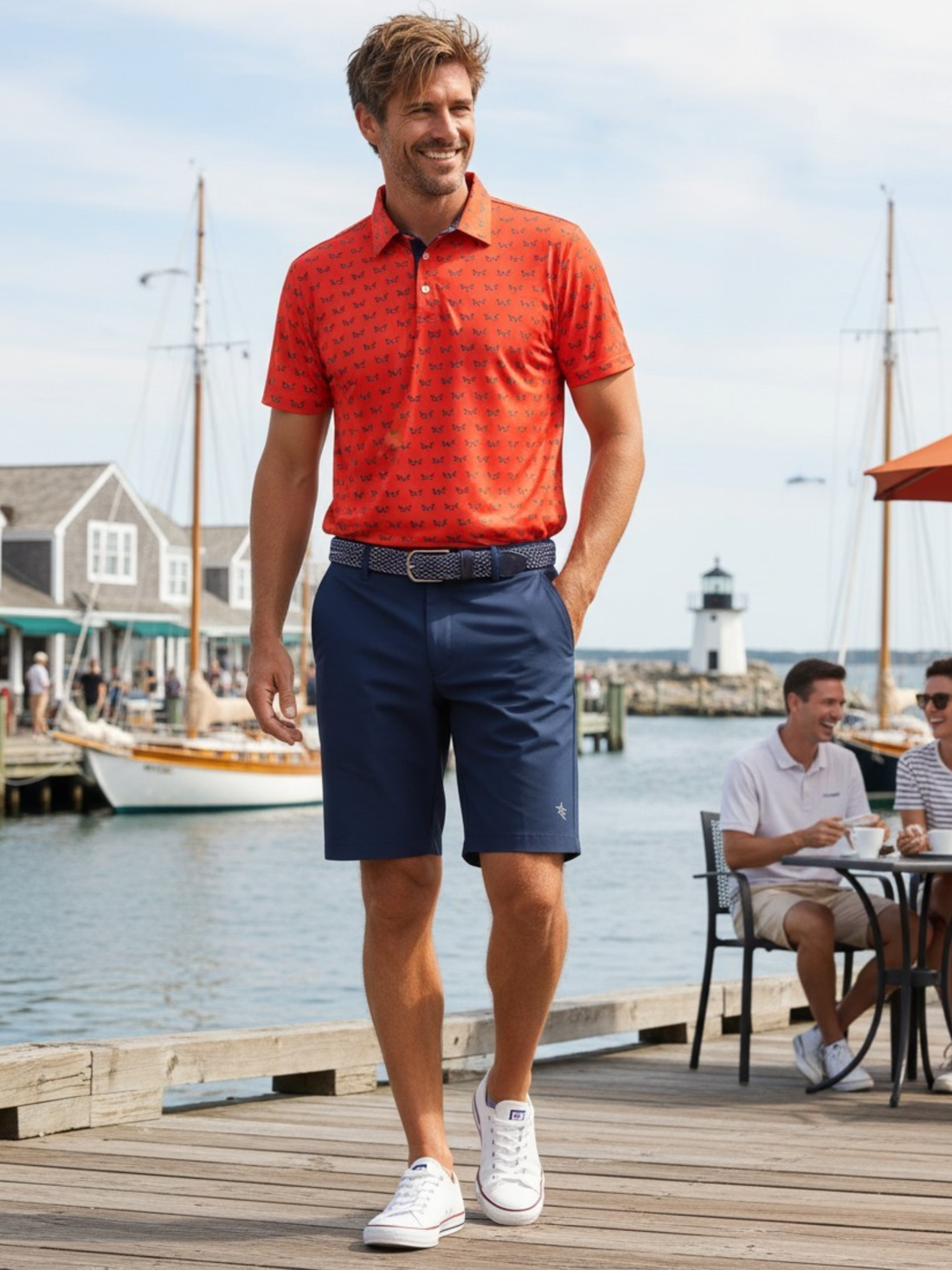 Navy Independence Performance Polo shirt by White Water Life, displayed with matching shorts on a model.
