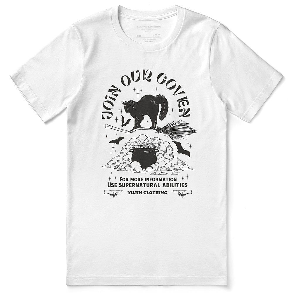 Join Our Coven Cat T-Shirt by Yūjin Clothing featuring a playful cat graphic and mystical design on a comfortable cotton tee.