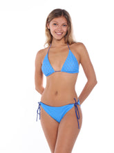 Light blue string bikini top from White Water Life featuring adjustable ties and minimal coverage.