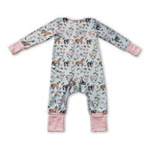 Pink pig, chicken, and cow farm-themed baby girl zipper romper by Mini Rodeo, featuring colorful farm animal prints and soft fabric.