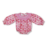 Pink bow smocked baby girl romper by Mini Rodeo, featuring a Valentine&