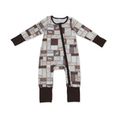 Brown camo hunting dog baby boy zipper romper by Mini Rodeo, long sleeve boy sleeper with zipper front and playful animal print.