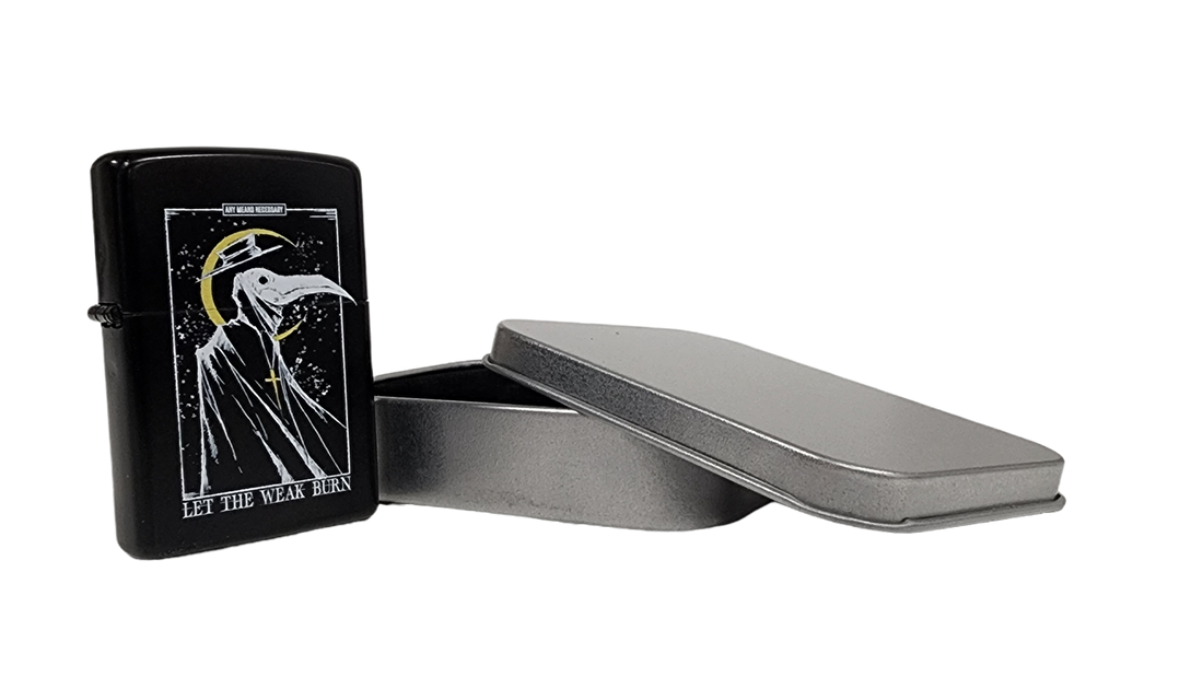 Let The Weak Burn lighter by Any Means Necessary Clothing, featuring a sleek design and compact size for easy use.