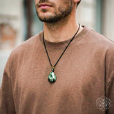Seraphinite pendant necklace called The Angel by My Side from Conscious Items, shown worn as a stylish jewelry piece.
