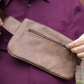 Shield Your Body Metro vegan leather cross body fanny pack with mobile phone pocket, worn as a stylish lifestyle accessory.