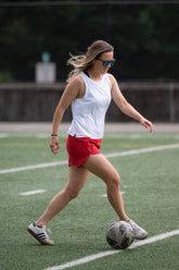 Goal Five boxy crop tank top worn in a lifestyle setting, showcasing its relaxed fit and casual style.