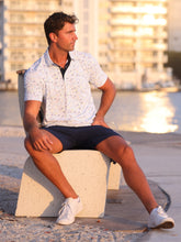 White Water Life Links Print Polo shirt featuring a classic polo design with a stylish print, displayed on a plain background.