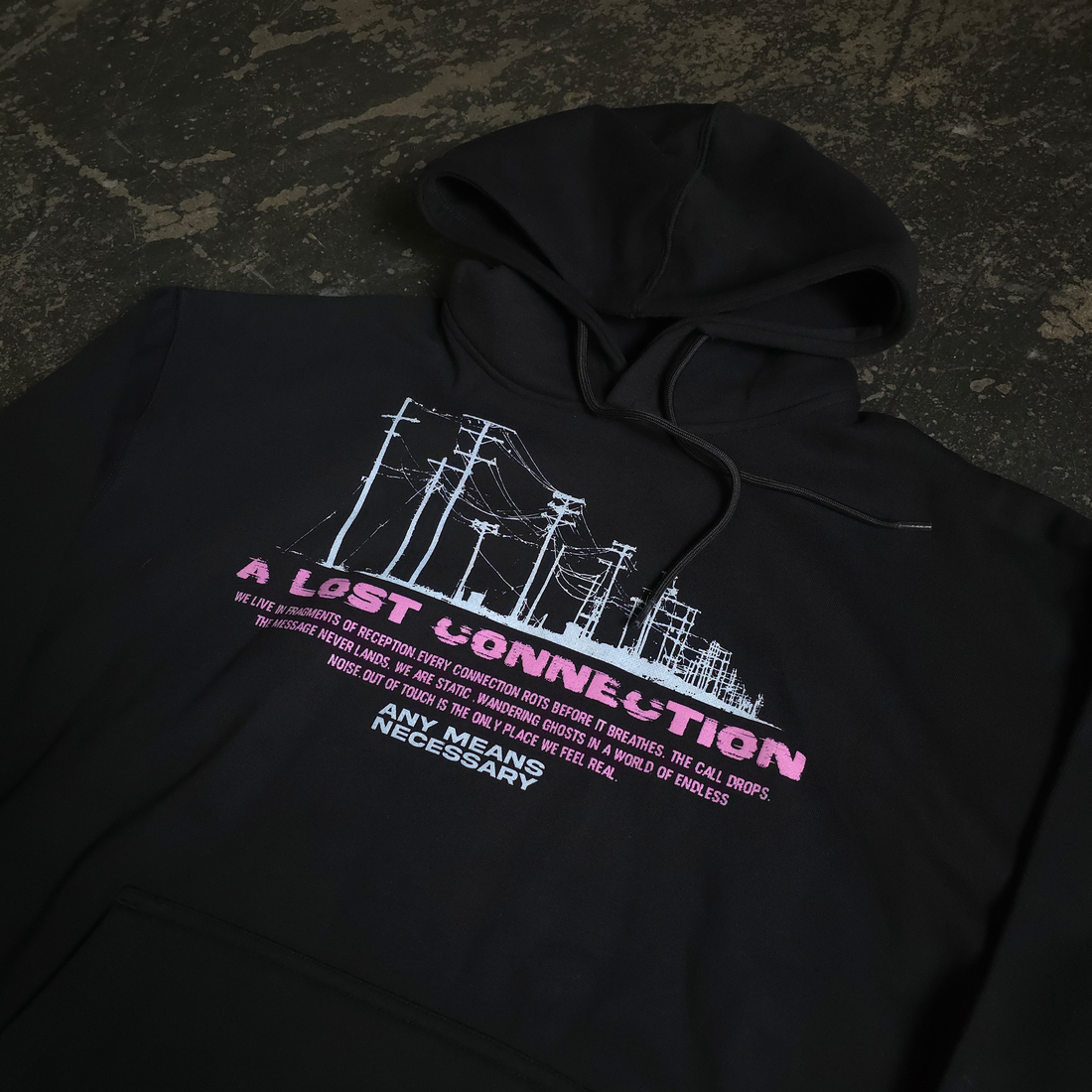 Black Lost Connection hoodie from Any Means Necessary Clothing, showcasing the front design and cozy pullover style.