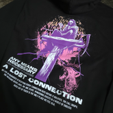 Black Lost Connection hoodie by Any Means Necessary Clothing, close-up of front view showing logo and hoodie details.