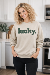 Fitkitty Culture Lucky Charm crewneck sweatshirt displayed in a modern kitchen setting, showcasing comfortable women&