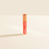 YENSA Luxe Lip Nourishing Oil with hyaluronic and vitamin E, featuring a vibrant coral lip gloss in a sleek tube.