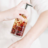 Pretty Farm Girl Lymph Love Body Oil for Massage, a health and beauty product with a sleek bottle and massage application.