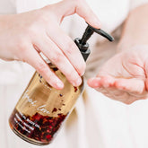 Bottle of Pretty Farm Girl Lymph Love Body Oil for massage, featuring natural ingredients and a soothing spa vibe.