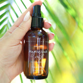 Pretty Farm Girl magnesium mist body spray toner bottle with a spray nozzle, shown on a neutral background.