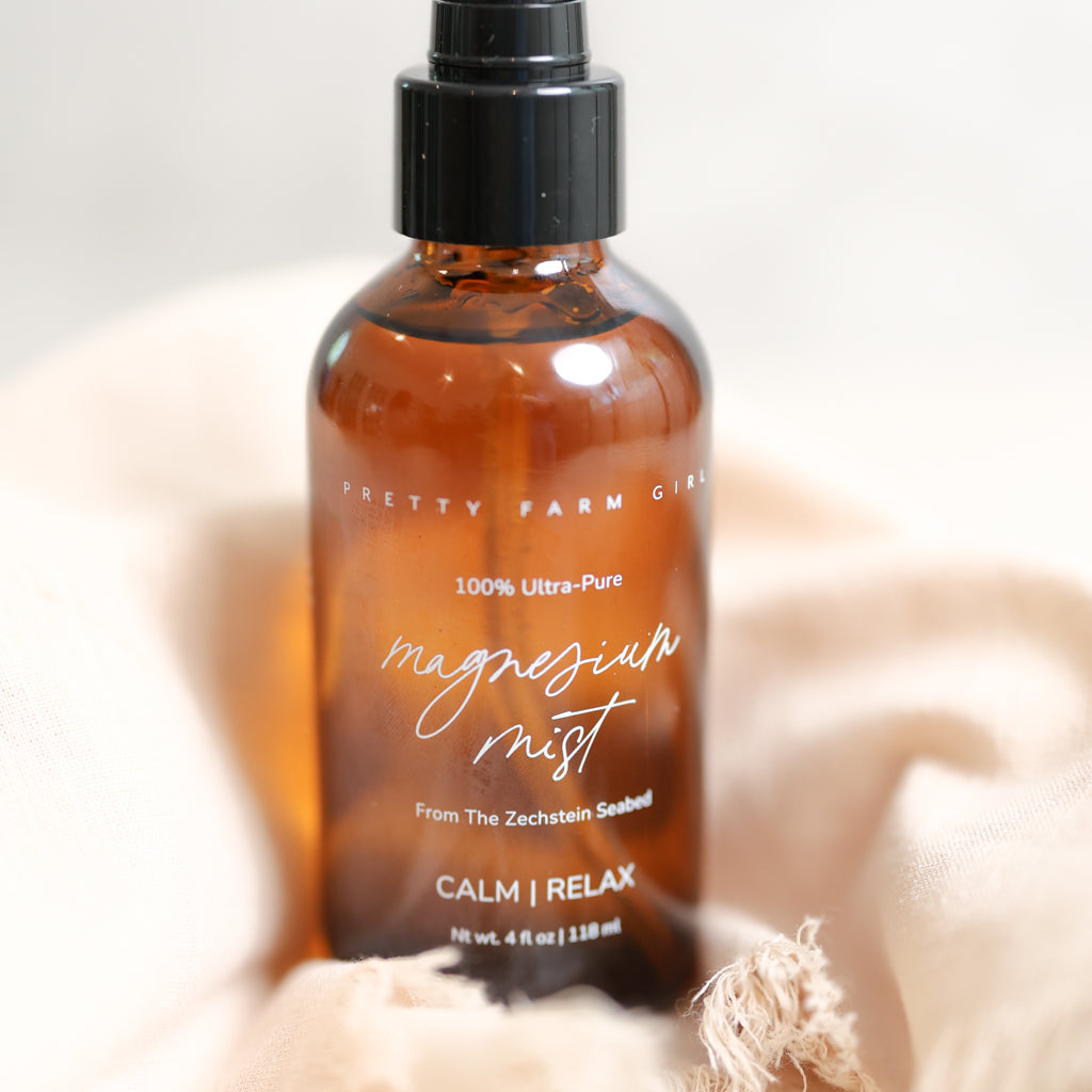 Pretty Farm Girl magnesium mist body spray toner with lavender and aloe vera for soothing skin, shown in a spray bottle.