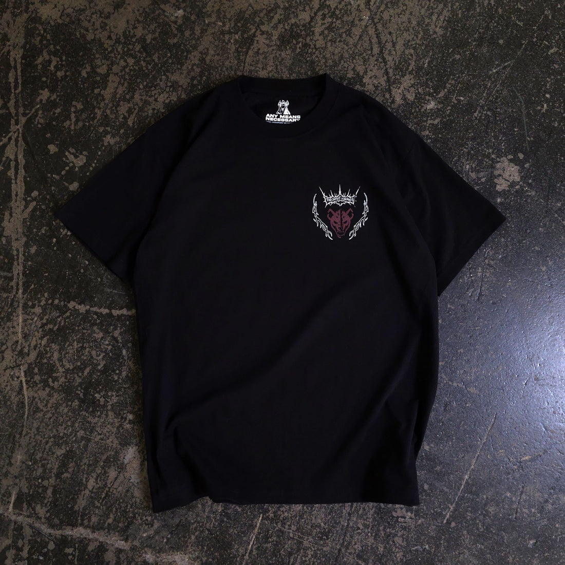 Black Mantra T-Shirt from Any Means Necessary Clothing, front view showing bold statement design on soft cotton shirt.