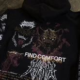 Black Mantra Zip Up Hoodie by Any Means Necessary Clothing, close-up view showing front zipper and hoodie details.