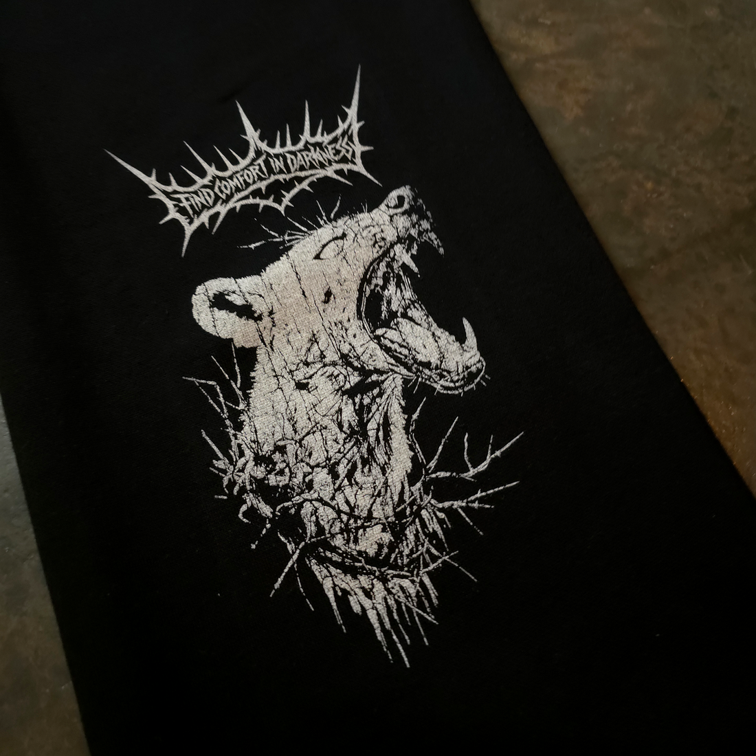 Close-up of black Mantra sweatpants by Any Means Necessary Clothing showing the soft fabric and relaxed fit.