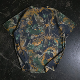 Back view of Any Means Necessary Clothing Mayhem T-Shirt with camouflage design and bold graphic print.