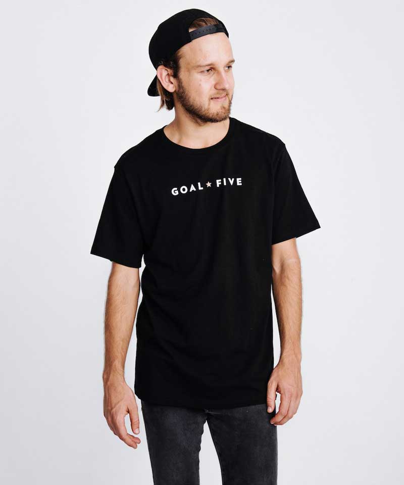 Men wearing black cotton T-shirt by Goal Five, casual lifestyle clothing, front view showing classic fit and soft fabric.