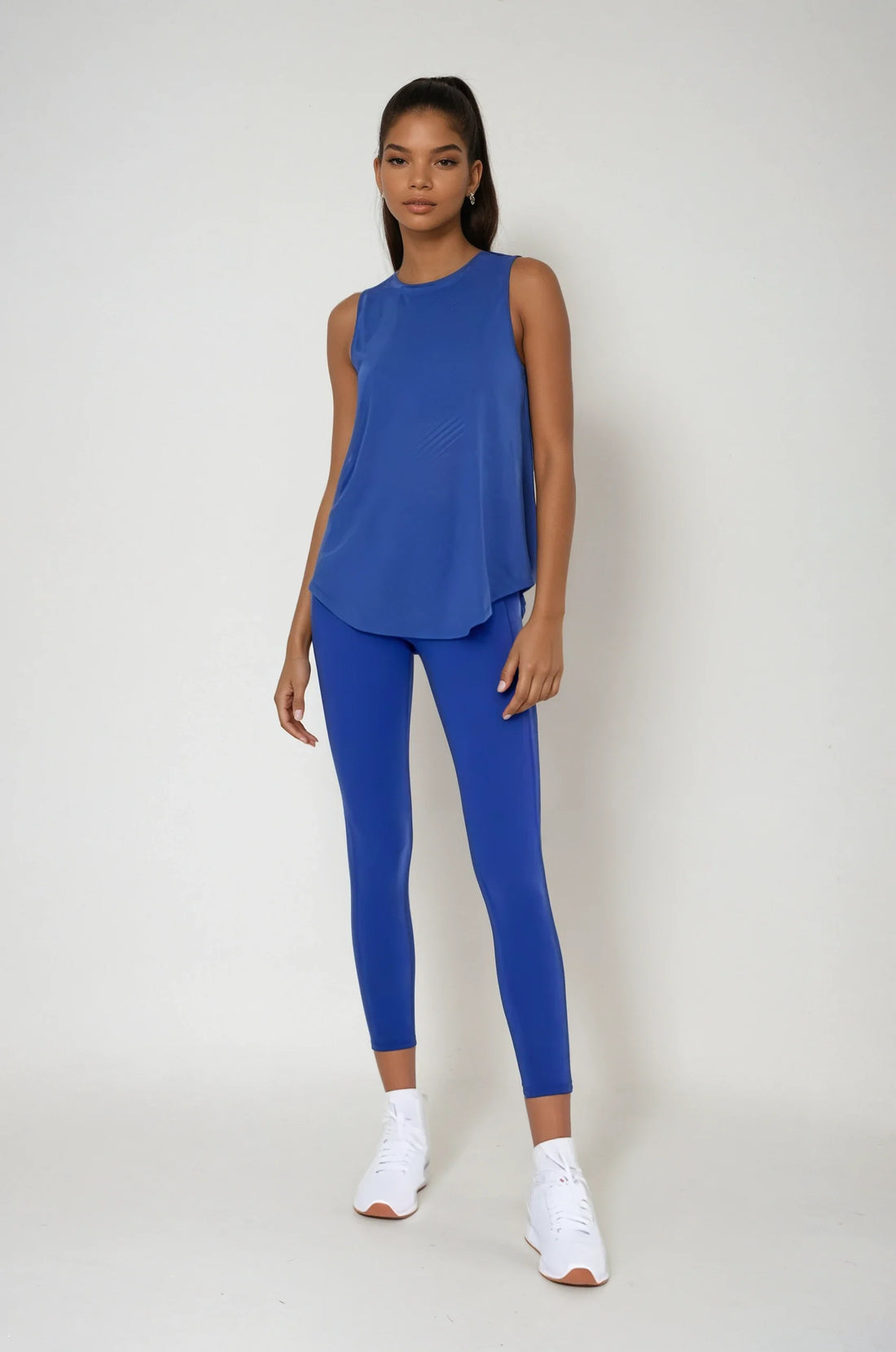 Blue sheer striped mesh active tank top with cut-out back from Fitkitty Culture Athleisure Wear, designed for yoga and activewear.
