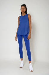 Blue sheer striped mesh active tank top with cut-out back from Fitkitty Culture, perfect for yoga and activewear.