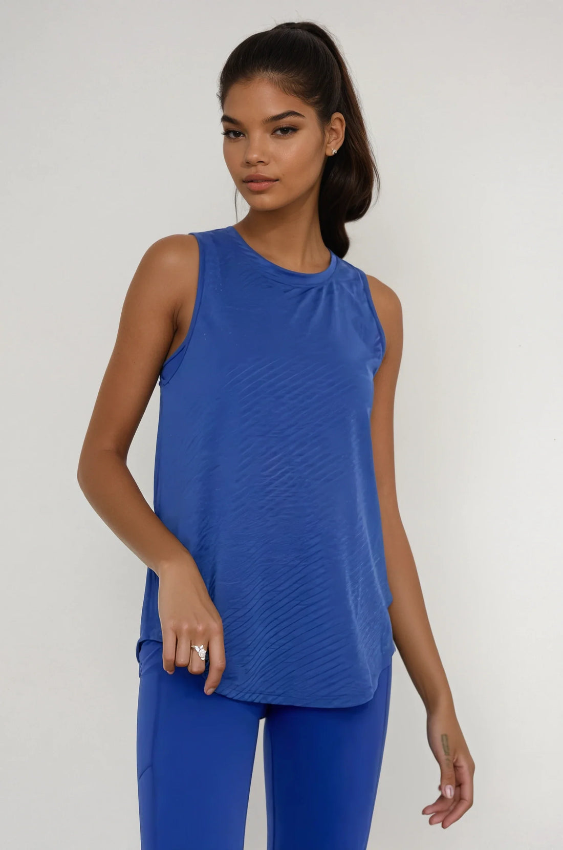 Blue sheer striped mesh active tank top with cut-out back from Fitkitty Culture athleisure wear.