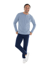 Long-sleeve Mystic Henley shirt by White Water Life, featuring a comfortable fit and casual style, shown in a natural outdoor setting.