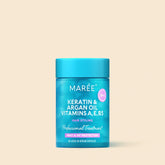Maree Keratin Oil Capsules for frizz control, showcasing glossy capsules in a natural setting, promoting smooth, manageable hair.