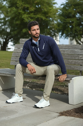 Navy Oceanside Pullover by White Water Life, showing the smooth stretch fabric on a bench-style display.