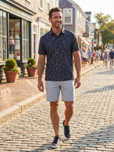White Water Life Pirate Polo shirt with navy and white striped design, featuring a small pirate logo on the chest.