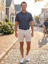 White Water Life Pirate Polo shirt with a nautical pirate design, featuring a collar and short sleeves, on a plain background.