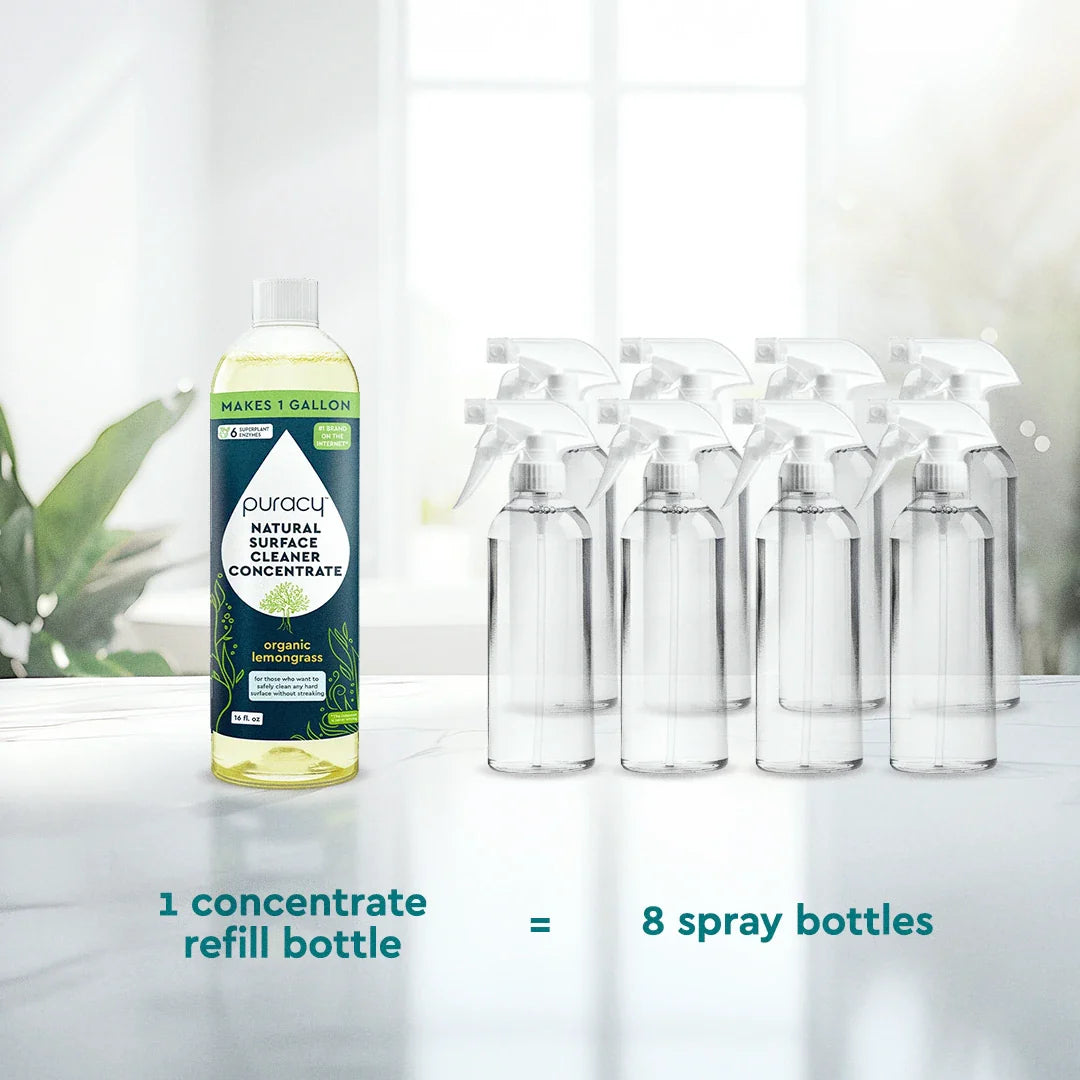 Puracy Everyday Multi-Surface Cleaner in a spray bottle, showing a clean, shiny countertop ready for use.