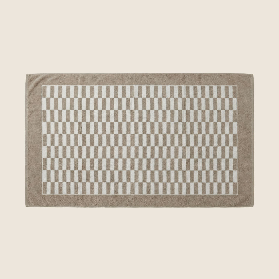 Italic Pietra Australian Cotton towels in brown, shown in a flat lay with soft, plush fabric details.