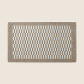 Italic Pietra Australian Cotton towels in brown, shown in a flat lay with soft, plush fabric details.