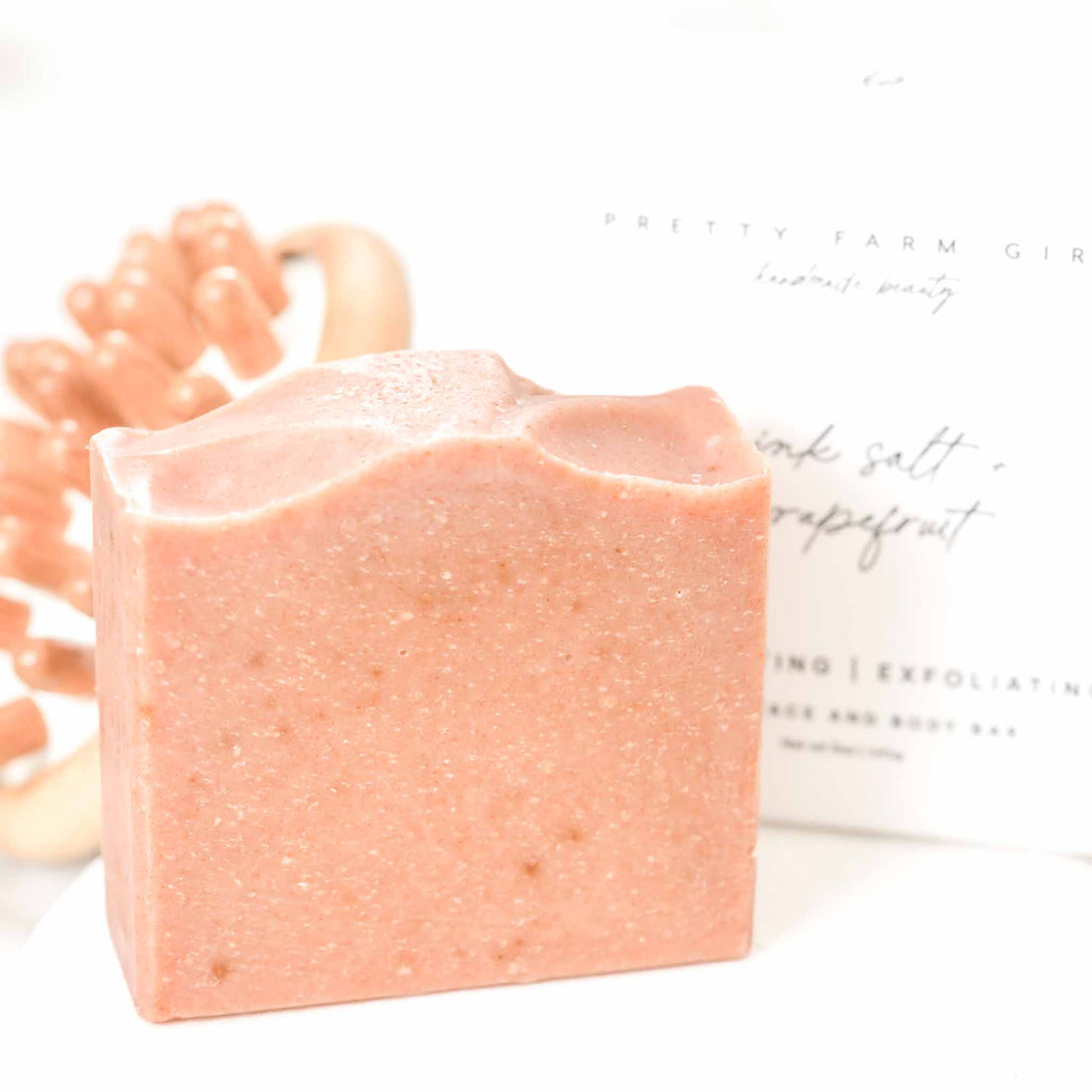 Handmade pink salt and grapefruit soap bar by Pretty Farm Girl, featuring tallow and goat milk for gentle cleansing.