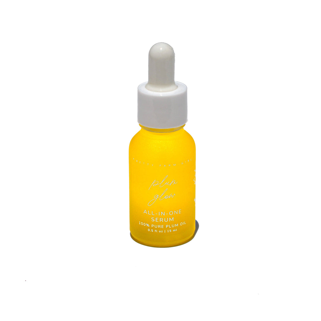Pretty Farm Girl Plum Glow Face Serum with 100% pure plum oil, featuring a sleek bottle and dropper for skincare application.