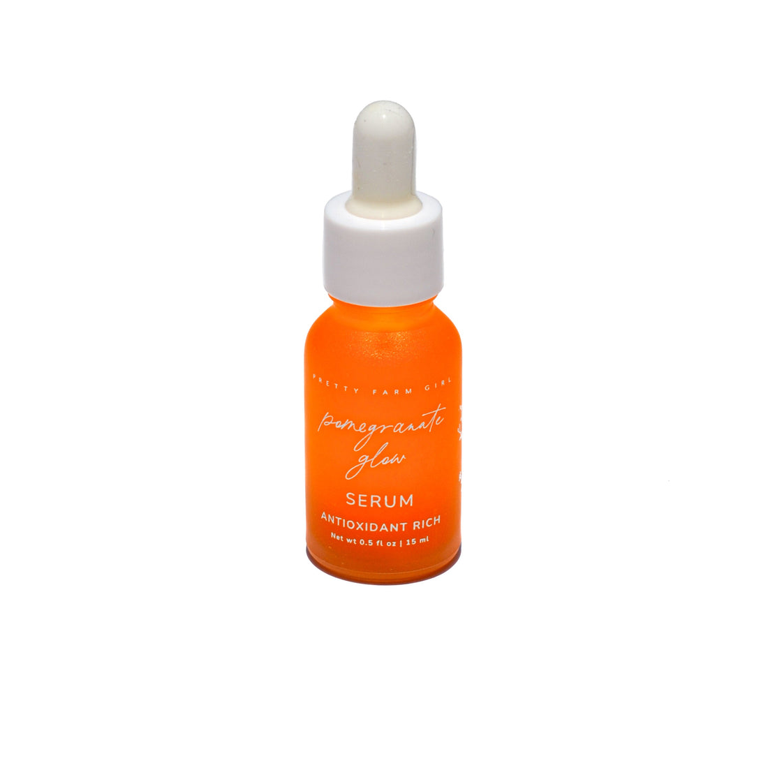 Pretty Farm Girl Pomegranate Glow Face Serum with natural ingredients, showcasing a sleek bottle and fresh pomegranate fruit.