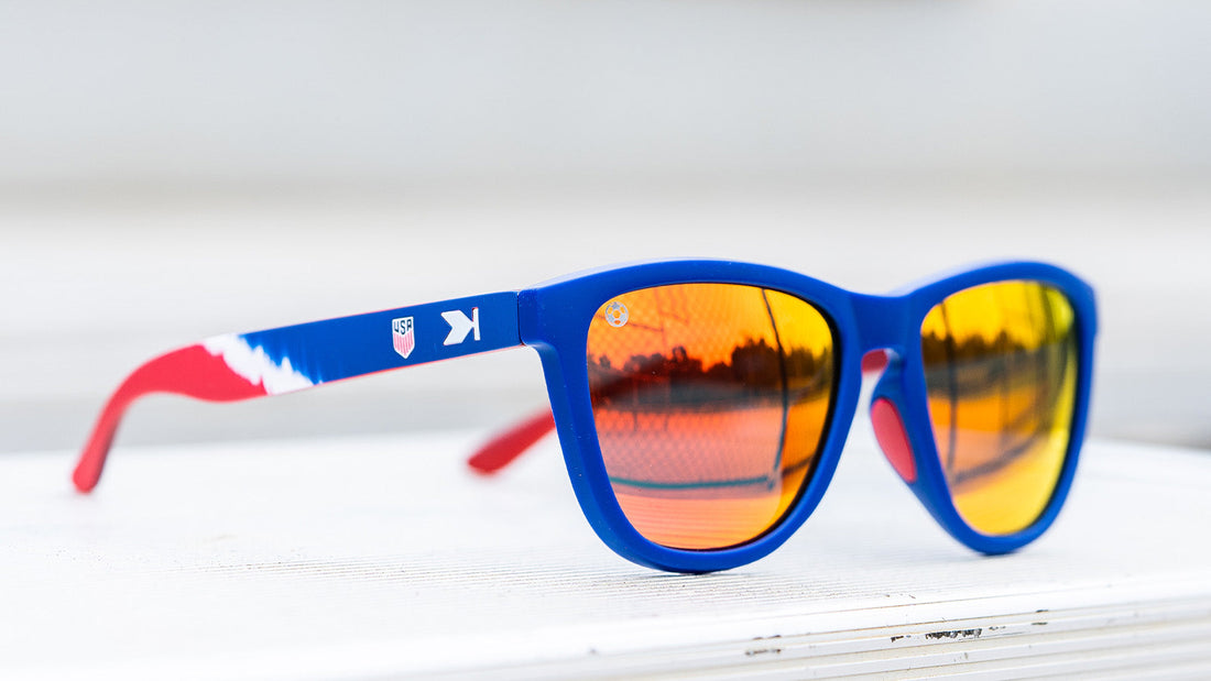 U.S. Soccer 2024 Knockaround sunglasses by Goal Five, featuring sporty lifestyle design and sleek frame on a white background.