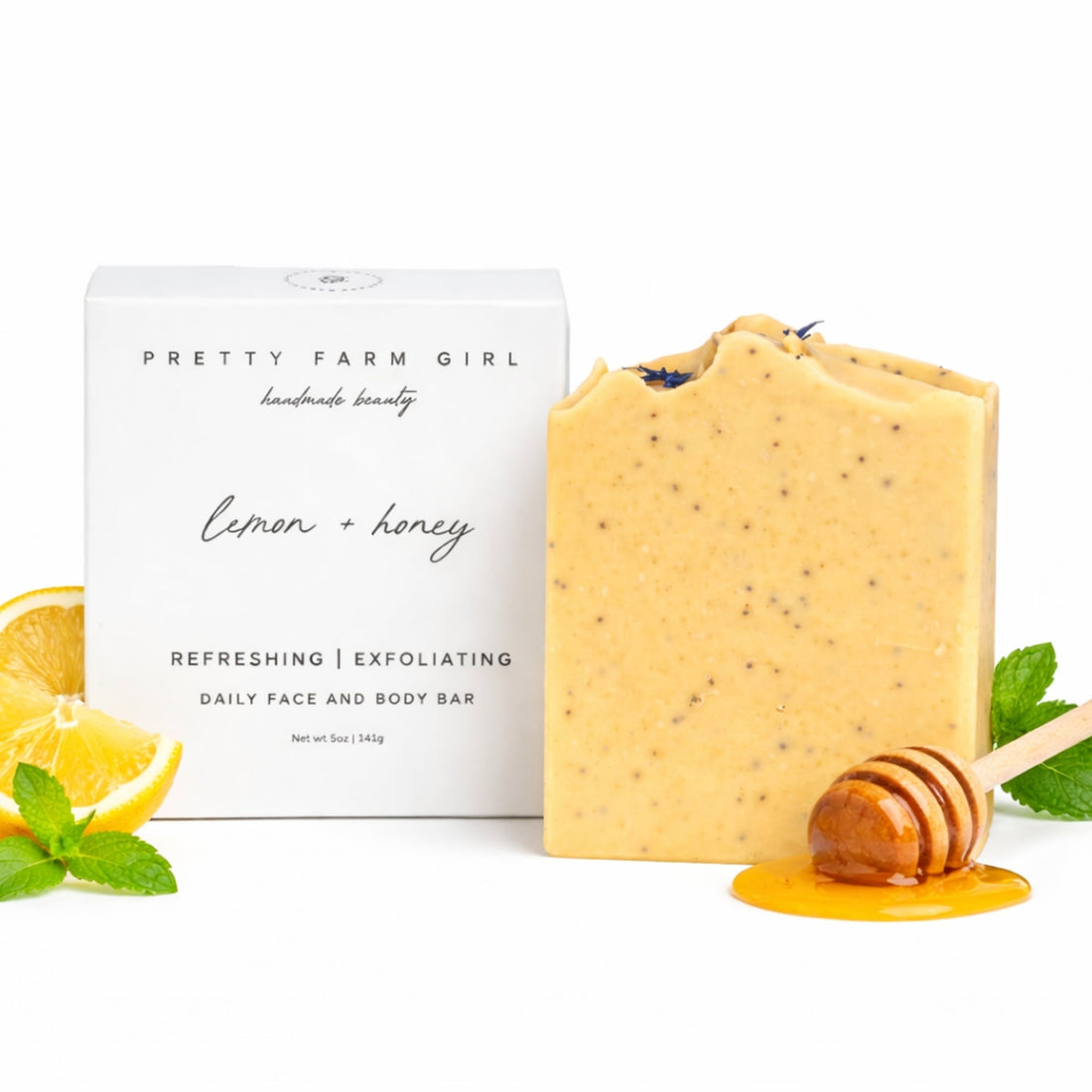 Handmade lemon, honey, and poppy seed tallow and goat milk soap bar by Pretty Farm Girl, featuring fresh citrus and natural ingredients.