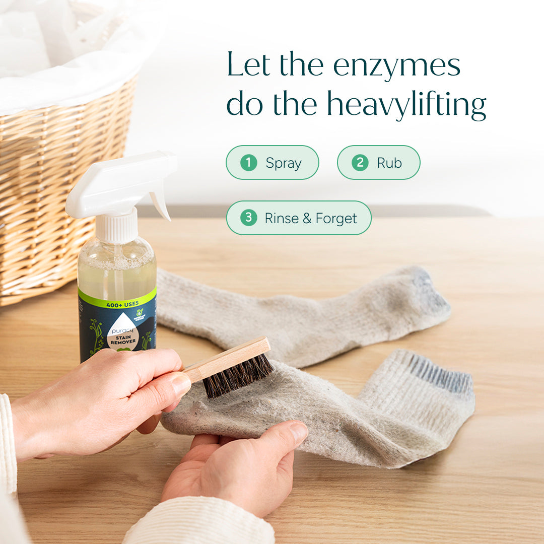 Puracy laundry stain remover in a 12oz bottle with a white label, designed to eliminate stubborn stains from clothes.