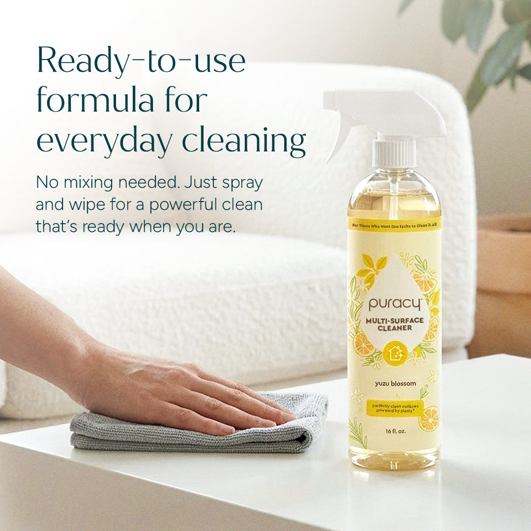 Puracy multi-surface cleaner spray bottle with a white label and blue accents, suitable for cleaning various household surfaces.